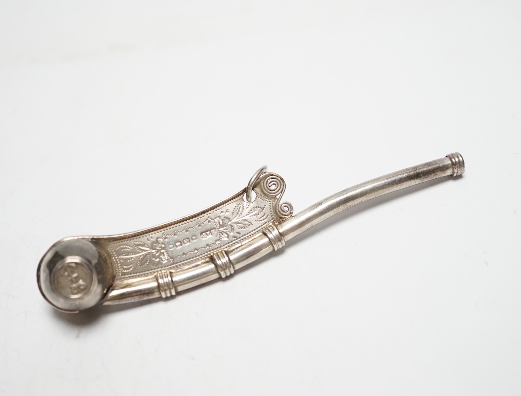 A Victorian engraved silver bosun's call, Hilliard & Thomason, Birmingham, 1883. 11.7cm.